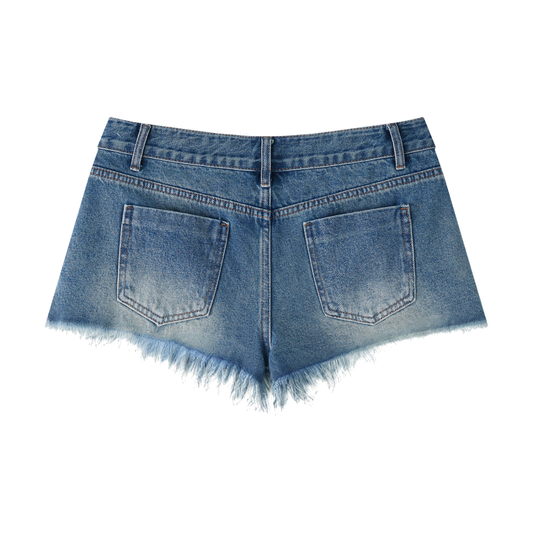 Back view of a pair of denim shorts with frayed edges on a white background