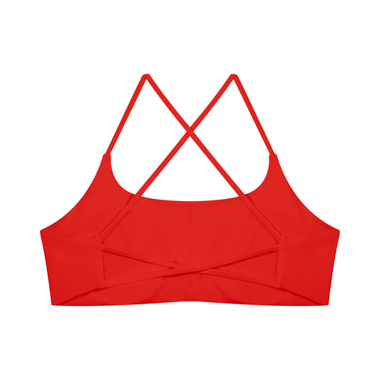 Red seamless U-neck sports bra for with crisscross straps for women on a white background