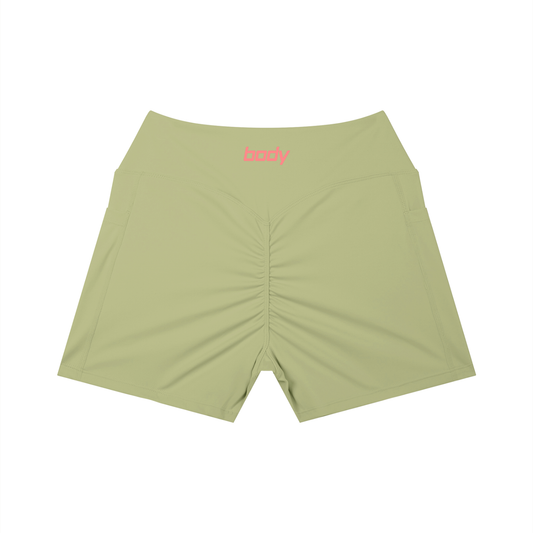 Light olive-green shorts with word 'body' on waist band shown against a white background