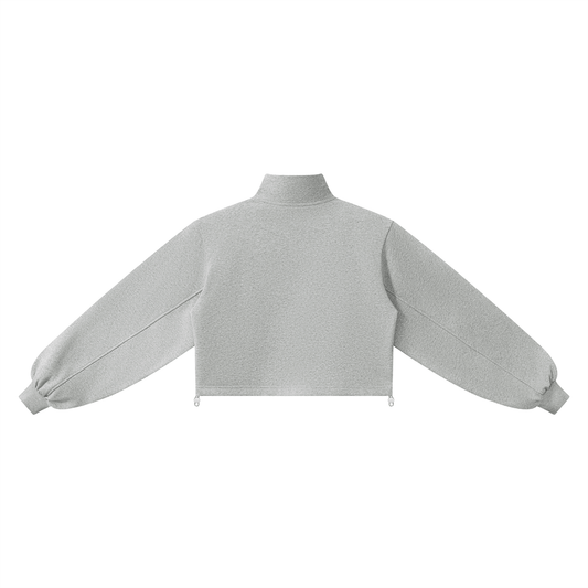 Back view of a light gray long-sleeve mock neck crop top sweatshirt with a quarter zip on a white background