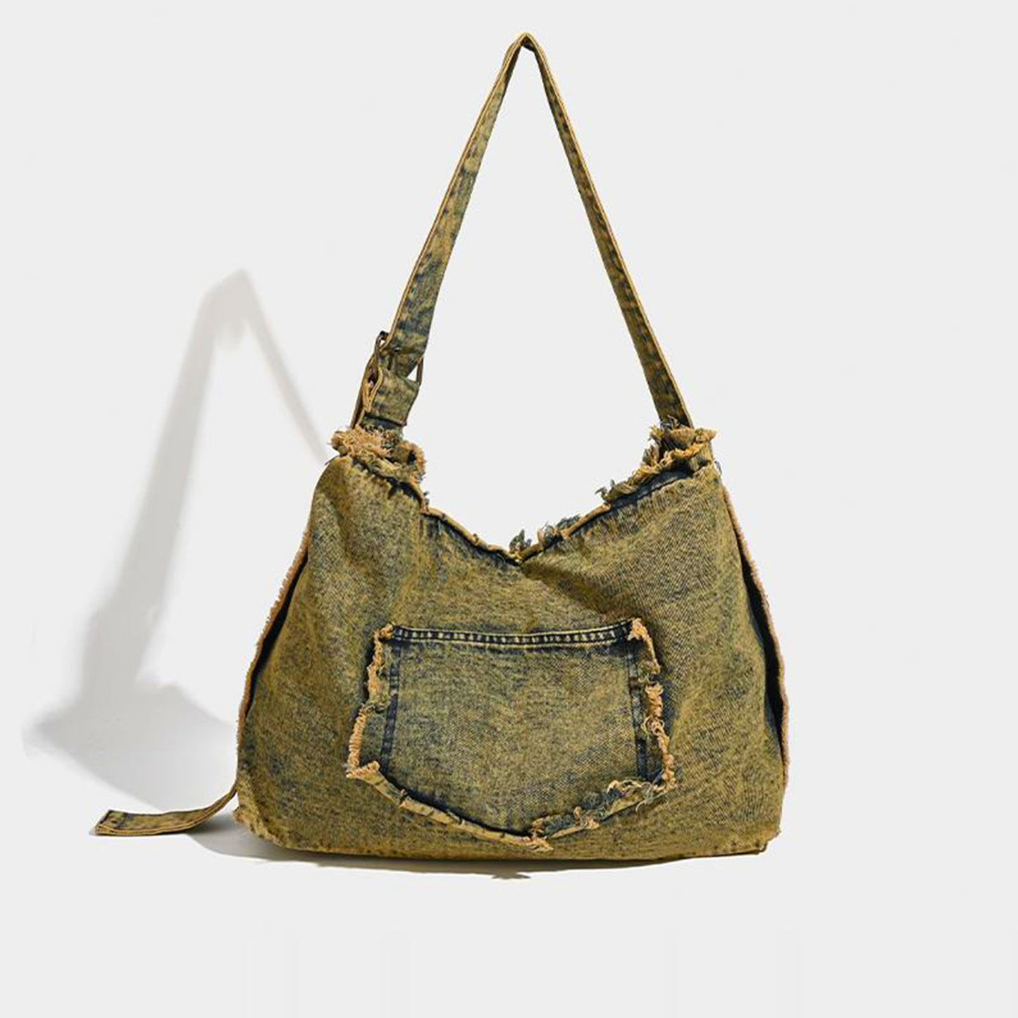 Denim handbag with a strap on a white background