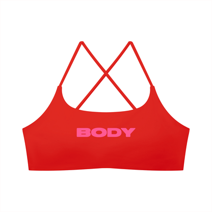 Red U-neck sports bra for women with pink 'BODY' text on a white background