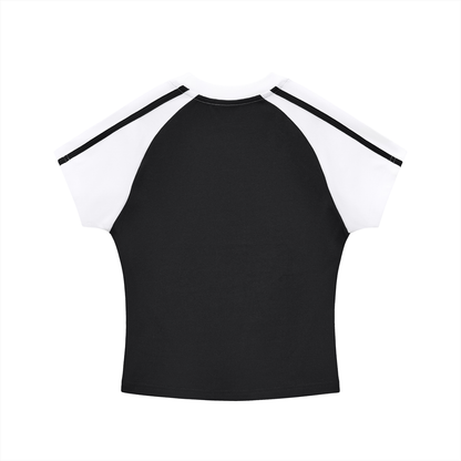 A black and white raglan t-shirt with short sleeves, featuring a solid black body and white sleeves with black stripes along the shoulders, shown against a plain white background.