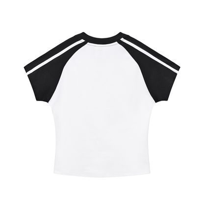 White crop top with black raglan sleeves on a white background