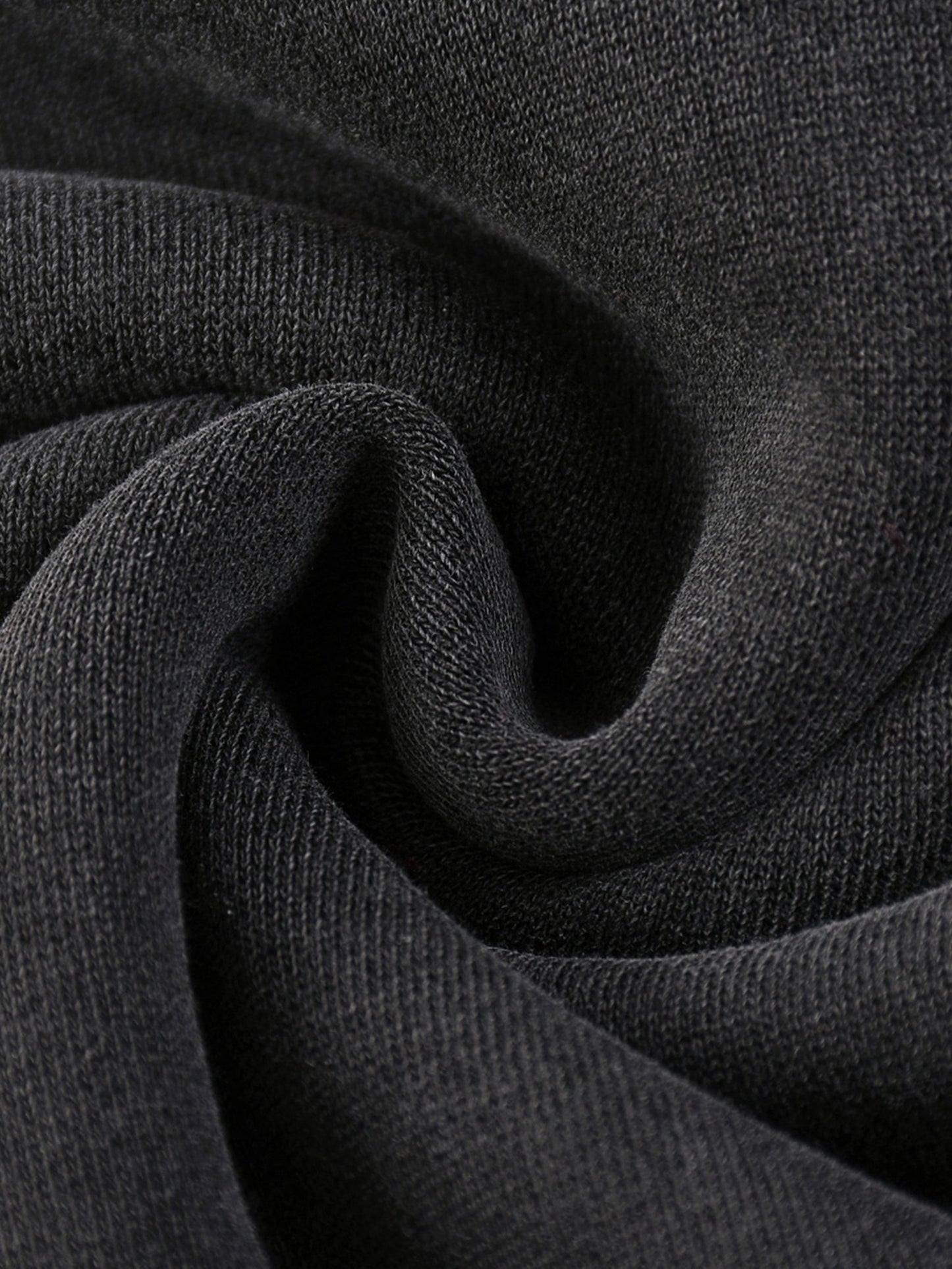Close-up of dark gray fabric with a textured pattern