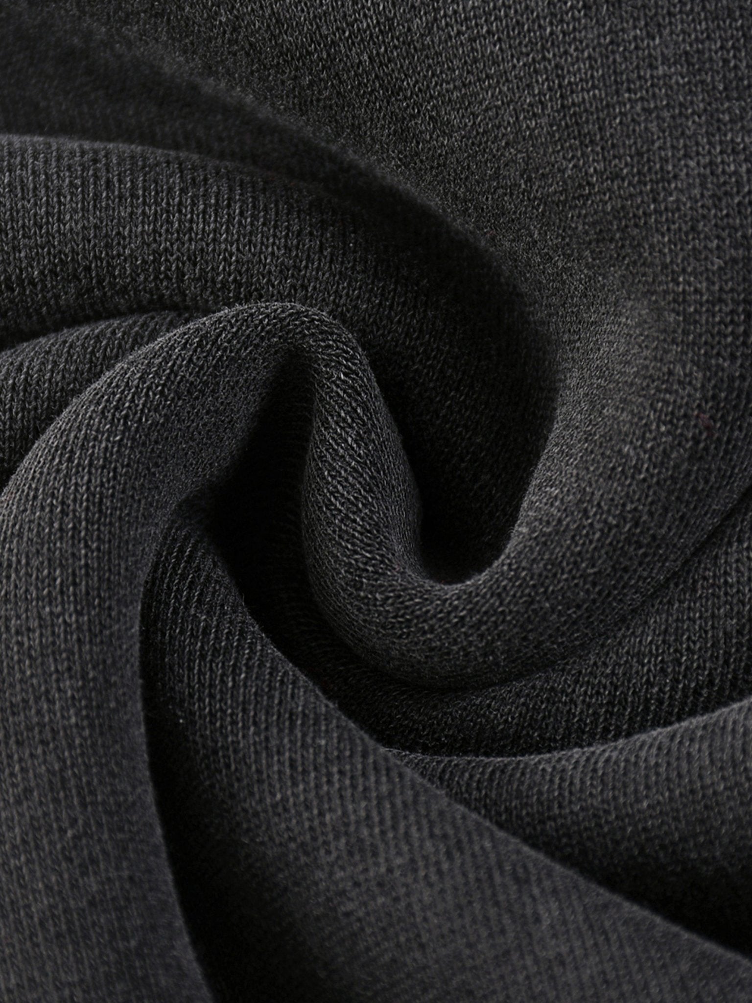 Close-up of dark gray fabric with a textured pattern