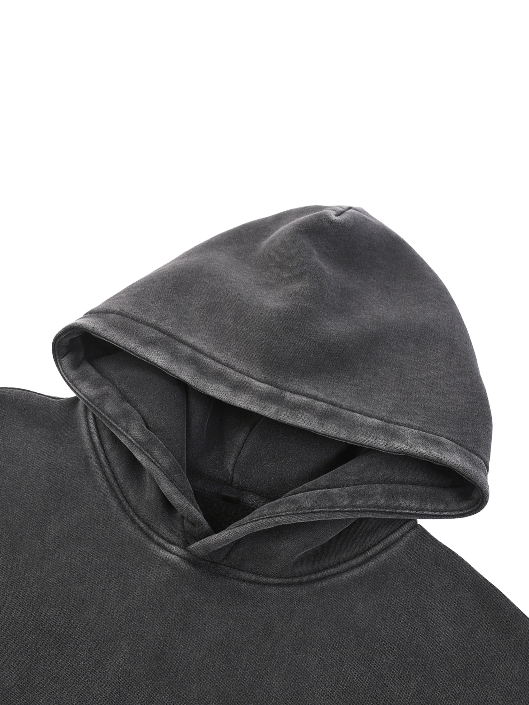 Close-up of a dark gray hooded garment on a white background