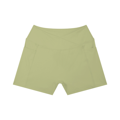 Light olive-green yoga shorts on a white background