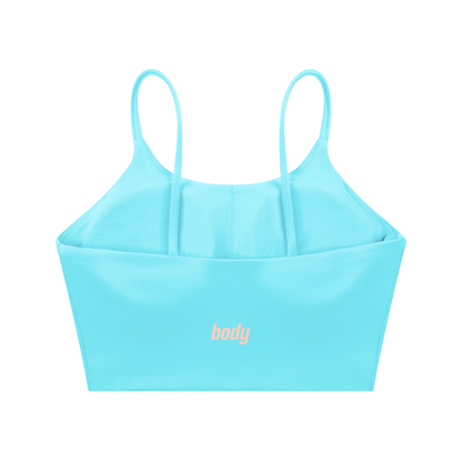 Back-view of light blue spaghetti-strap yoga bra with 'body' text on a white background