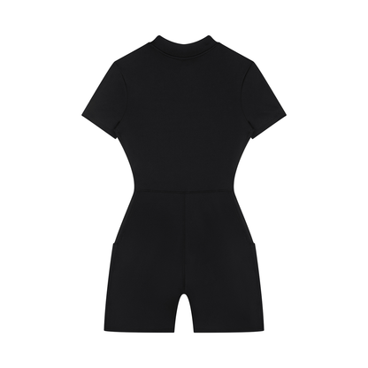 Back view of a black sporty romper on a white background