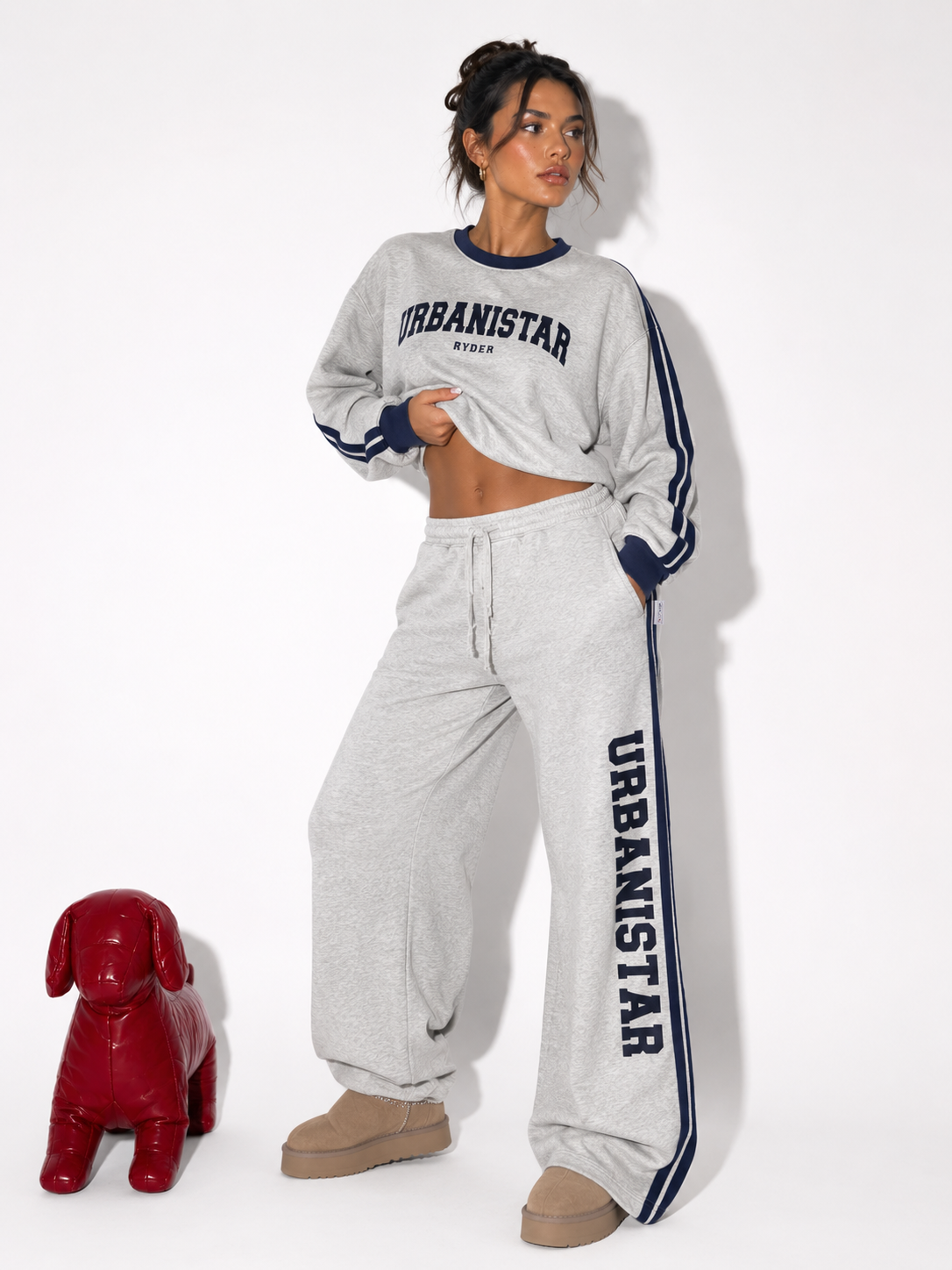 model wearing Urbanistar branded sweatshirt and pants.