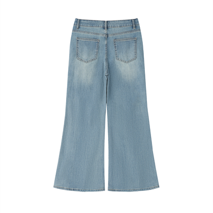 Light blue denim jeans on a white background
